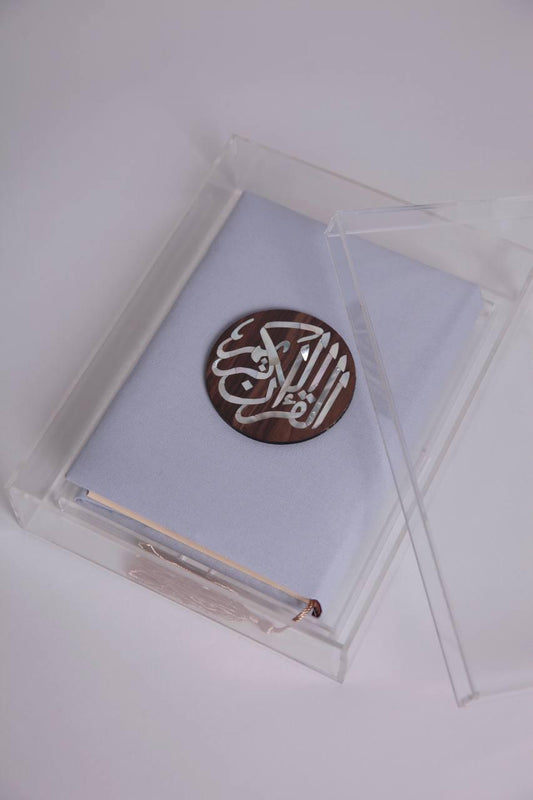 Small blue quran with round wooden msadaf
